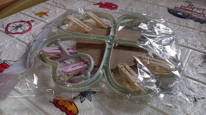 Wukusy heart-shaped clothes spin rack with 8 clips for drying underwear, baby clothes, socks, bras, towels, and cloth diapers.