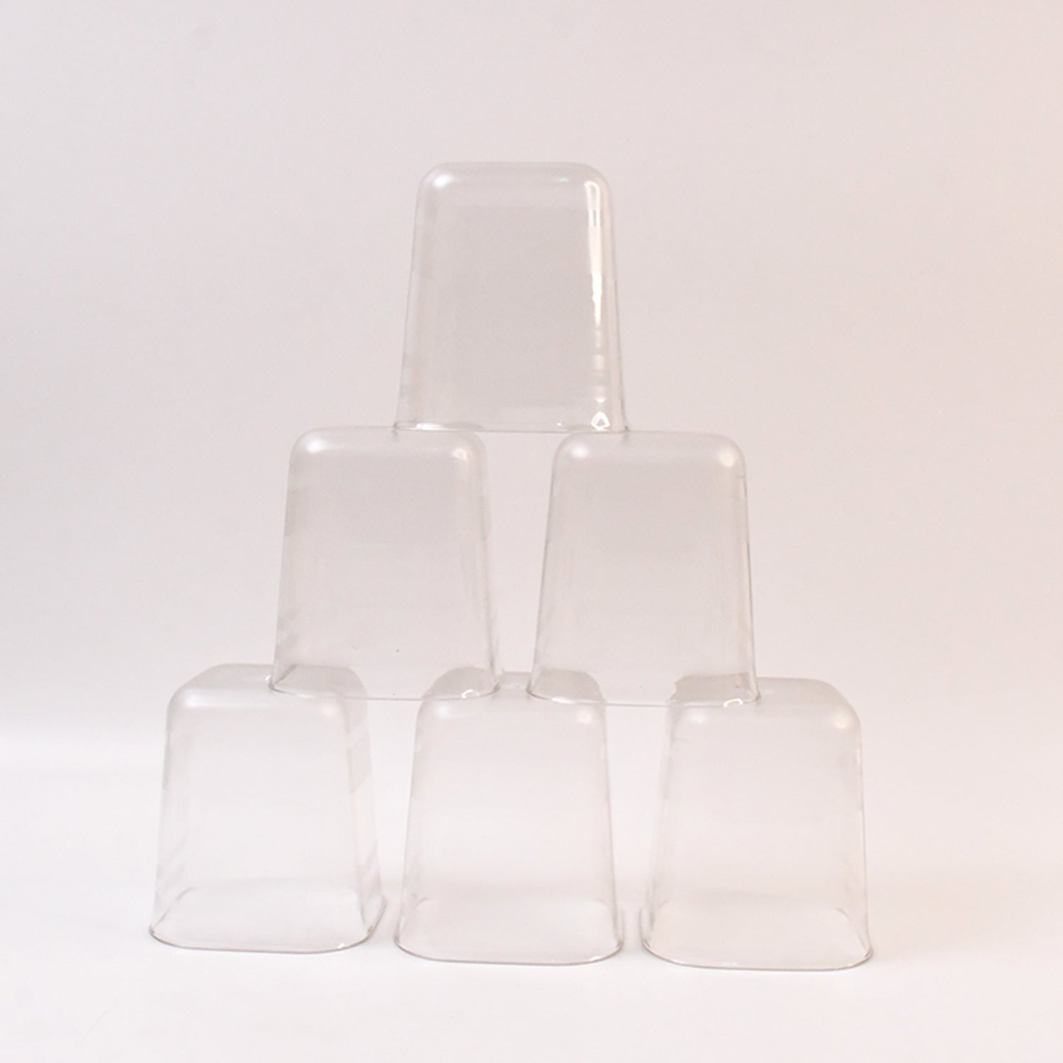 Six transparent diamond-shaped medium serving glasses by Wukusy for water, juice, and beverages in a home improvement setting.