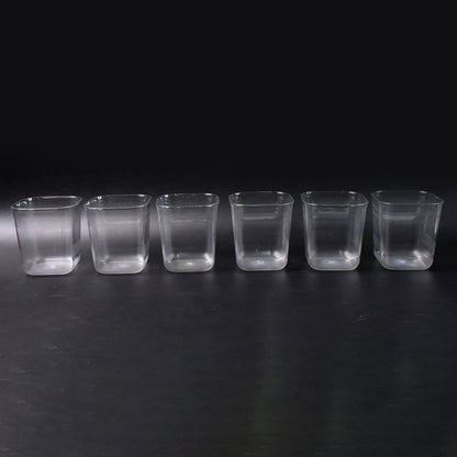 Six transparent diamond-shaped medium serving glasses by Wukusy, ideal for water, juice, and beverages at home.