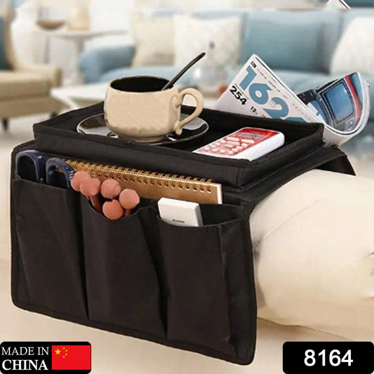 Black Wukusy sofa arm rest hanging storage bag for magazines, iPad, and books, ideal for organizing living room essentials.