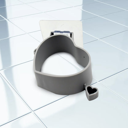 Wukusy adhesive wall mount holder for hair dryers, multifunctional home improvement accessory, shown attached to a wall.