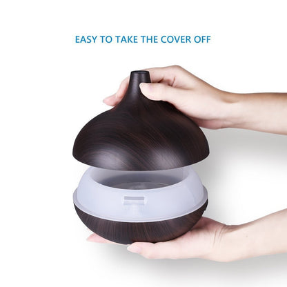 Wukusy aromatherapy humidifier with 7 colorful LED lights, 500ml capacity, and remote control for home improvement.