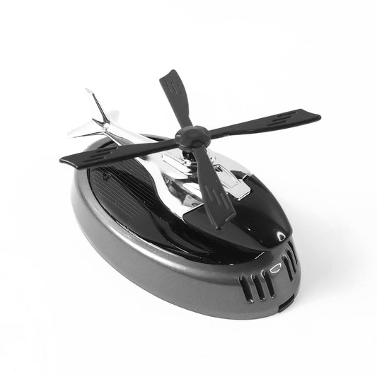 Wukusy car dashboard perfume diffuser with rotating blades, designed for home improvement, shown on a vehicle dashboard.