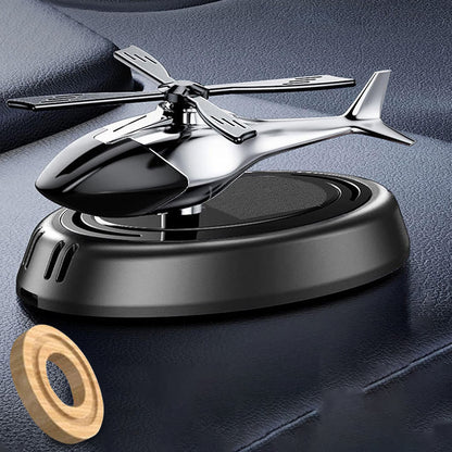 Wukusy car dashboard perfume diffuser with rotating blades, designed for home improvement, showing the sleek diffuser on a vehicle dashboard.