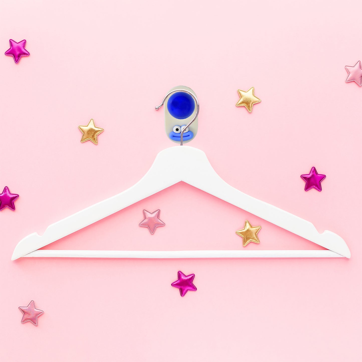 Colorful cartoon ball-shaped hook by Wukusy, self-adhesive for home improvement, perfect for hanging lightweight items.