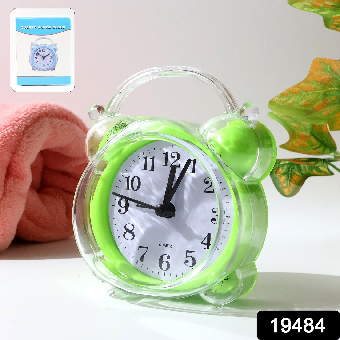 Wukusy classic quartz alarm clock showing time with a round face and black numbers on a white background.