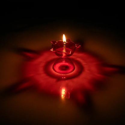 Set of four colorful plastic Diya candle cups with multi-shape designs for home decor by Wukusy.