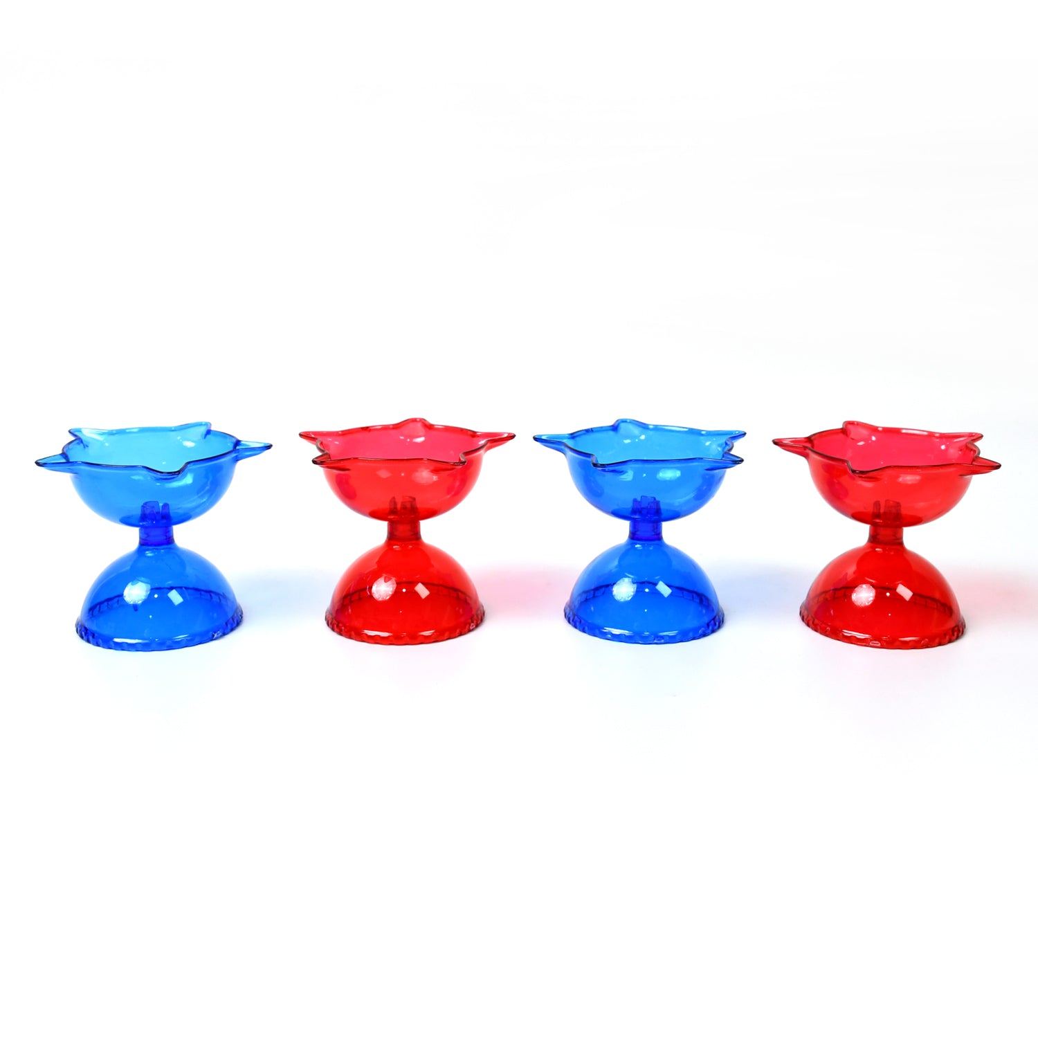 Set of four colorful plastic diya candle cups with multi-shape designs for home decor and illumination by Wukusy.