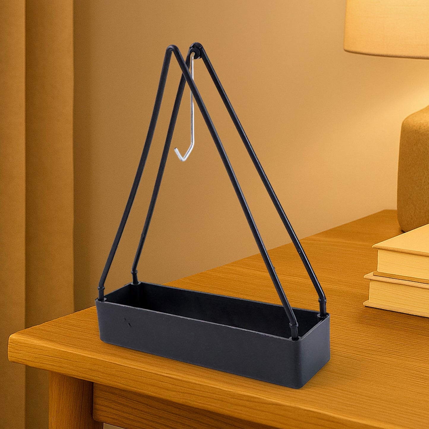 Wukusy compact triangle mosquito coil stand for home use, black metal design with three-legged support.