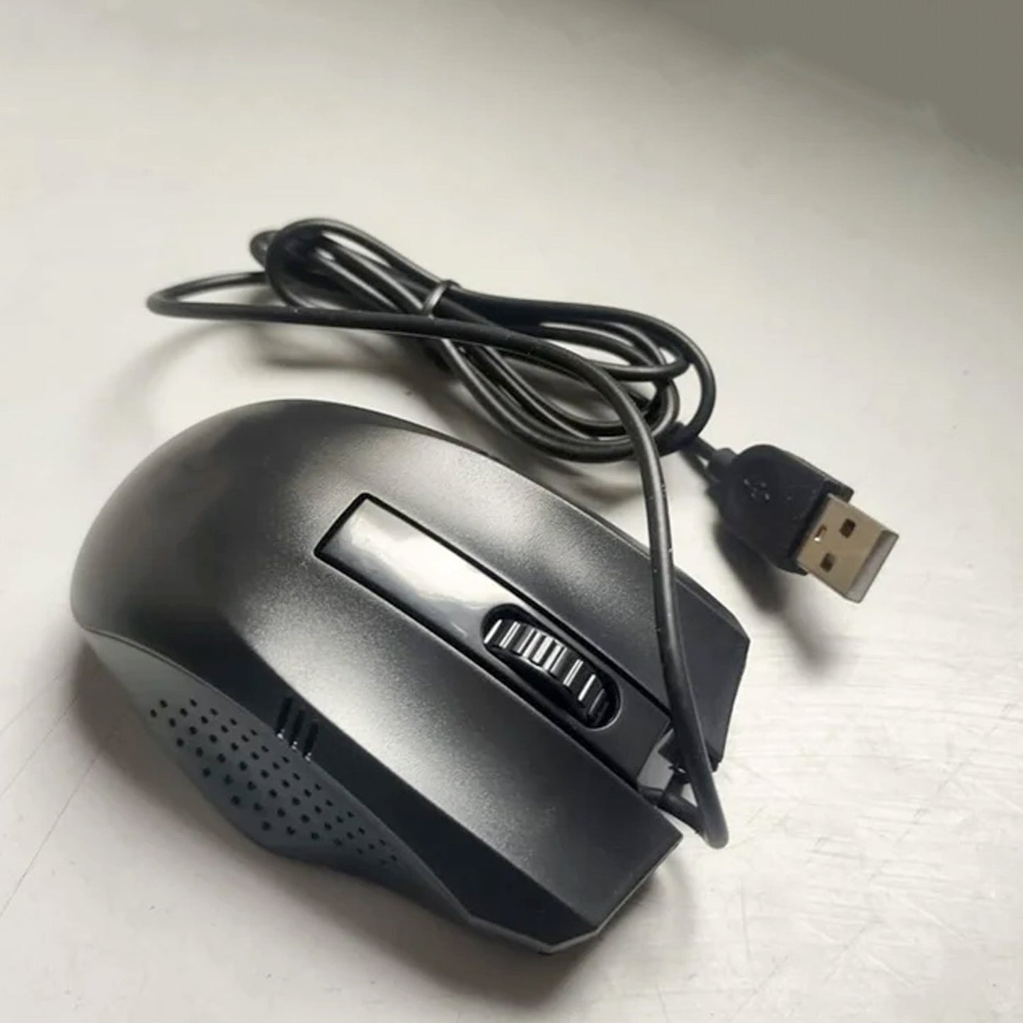 Wukusy wired optical computer and laptop mouse on a desk, black ergonomic design for home office use.