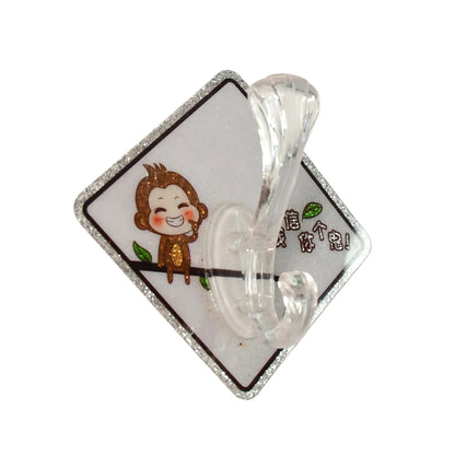 Cute cartoon print transparent wall hook with self-adhesive back, ideal for home improvement and organization by Wukusy.