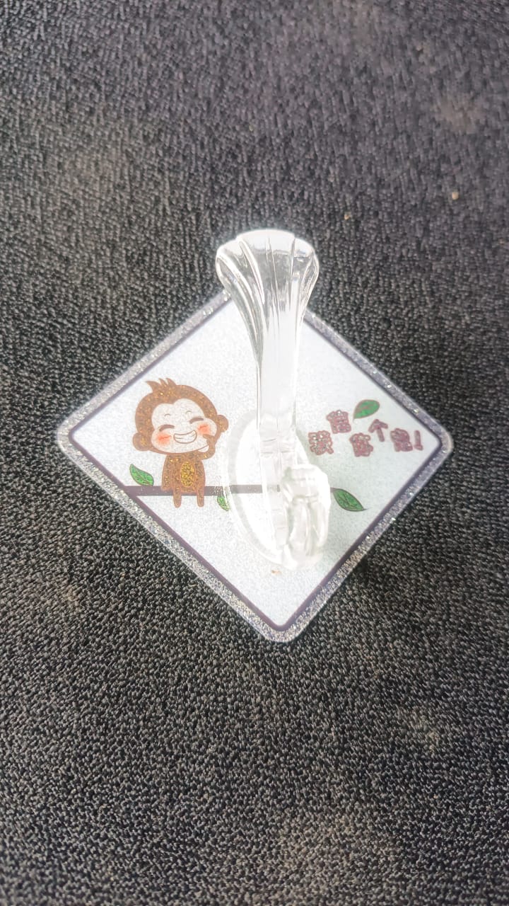 Cute cartoon print transparent wall hook with self-adhesive back from Wukusy, ideal for home organization and easy wall mounting.