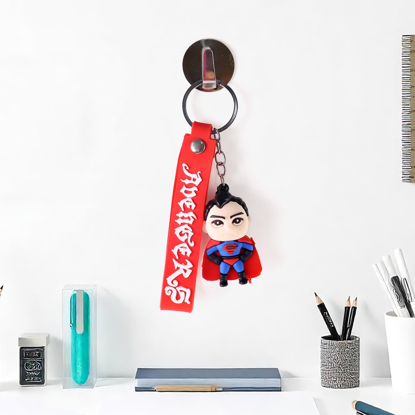 Cute cartoon silicone 3D key chain with metal hook strap by Wukusy for home improvement, featuring colorful textured design.