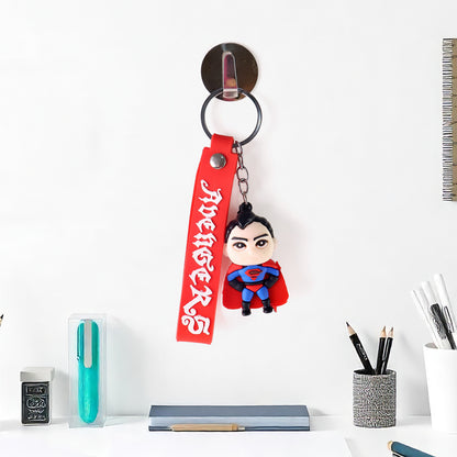 Cute cartoon silicone 3D key chain with metal hook strap by Wukusy for home improvement, featuring colorful textured design.