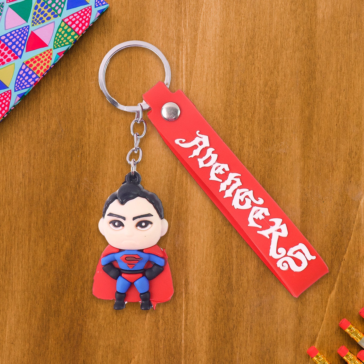 Cute cartoon silicone 3D key chain with metal hook and strap by Wukusy, perfect for home improvement or key organization.