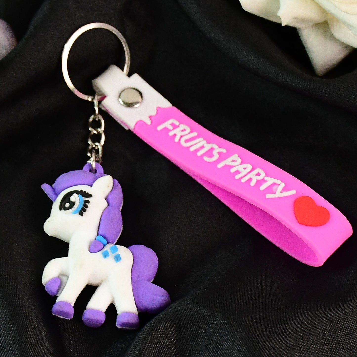 Cute cartoon unicorn keychain with silicone strap from Wukusy, featuring colorful unicorn design and durable attachment.