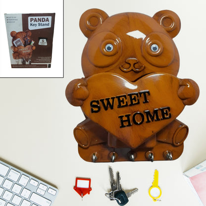Cute plastic panda wall key holder rack with five hooks, ideal for organizing keys and small items in home improvement.