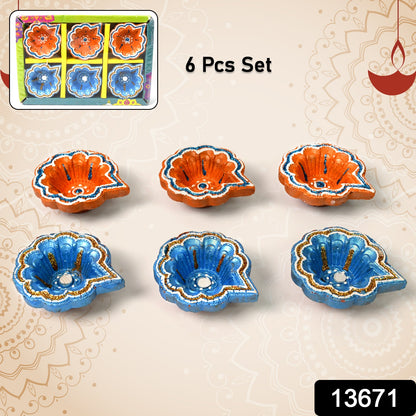 Set of 6 handmade decorative clay Puja Diyas for Diwali, painted with intricate designs, perfect for home lighting and decoration.