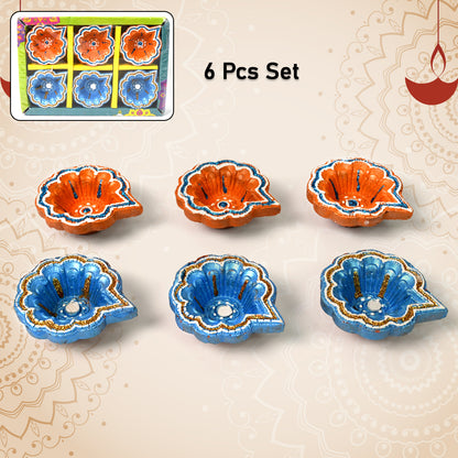Set of six handmade clay Puja Diyas by Wukusy, decorative hand-painted Diwali lamps for home improvement and festive celebrations.