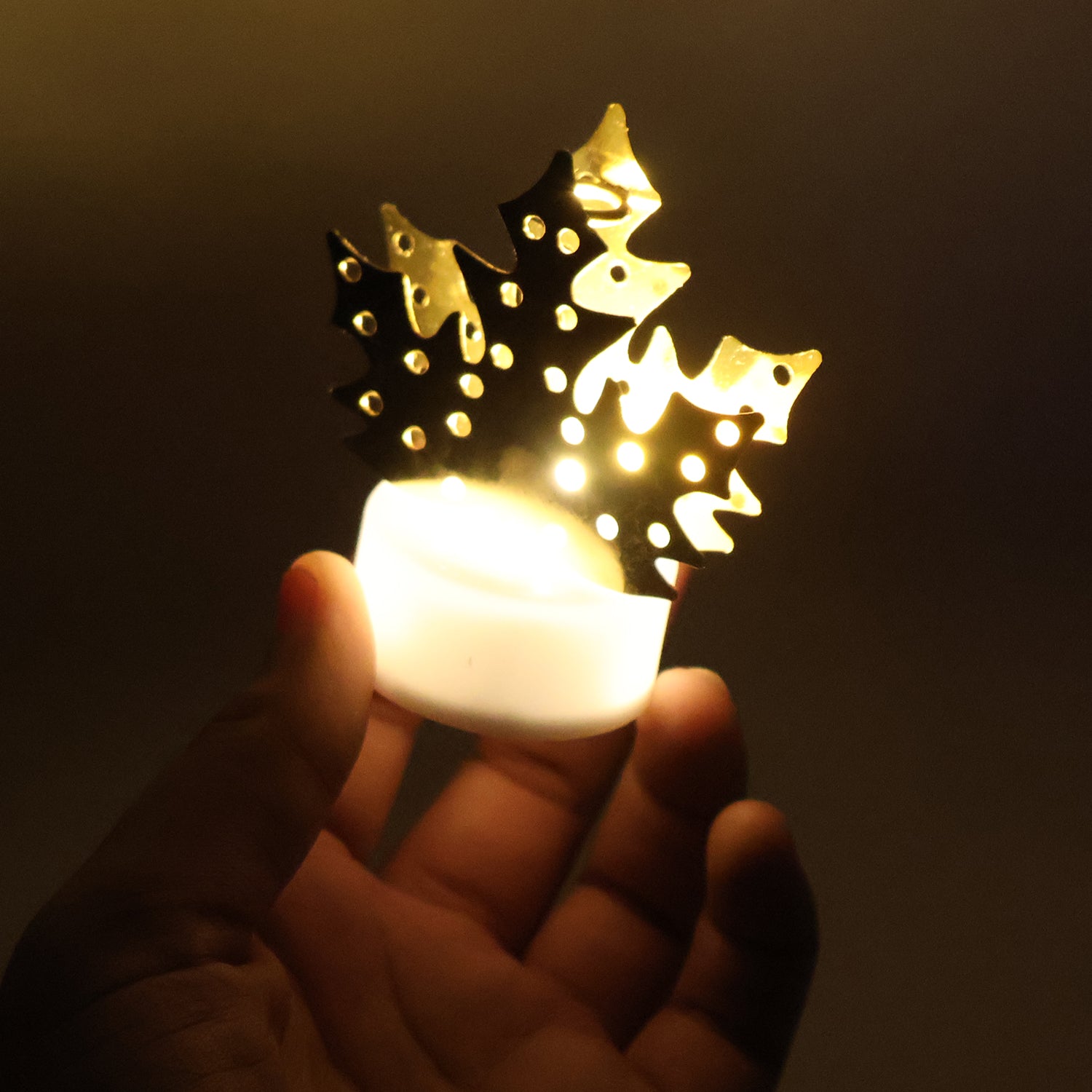 Decorative LED gold metal leaf diya lamp by Wukusy, ideal for home decor, featuring a gold leaf design with warm LED lighting.