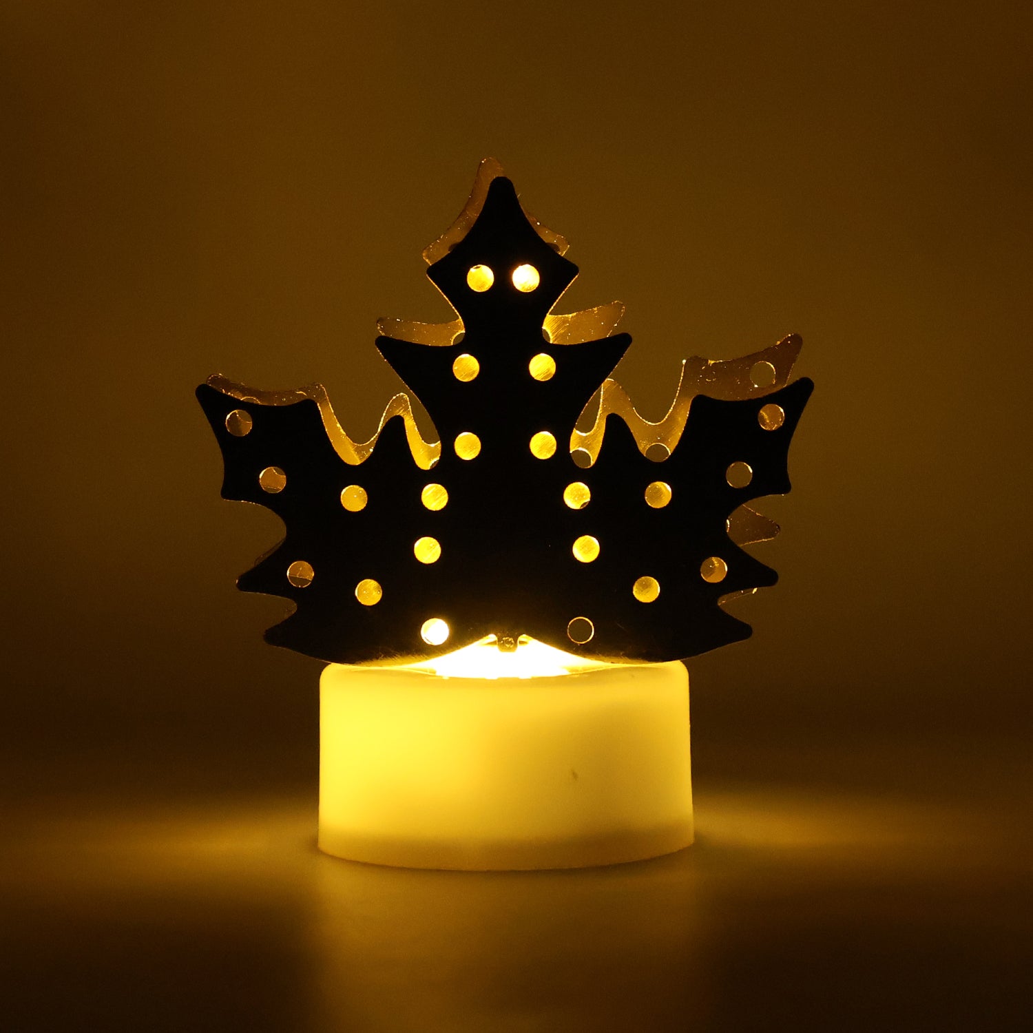 Decorative LED gold metal leaf diya lamp by Wukusy, used for home decor and improvement, featuring intricate leaf design.