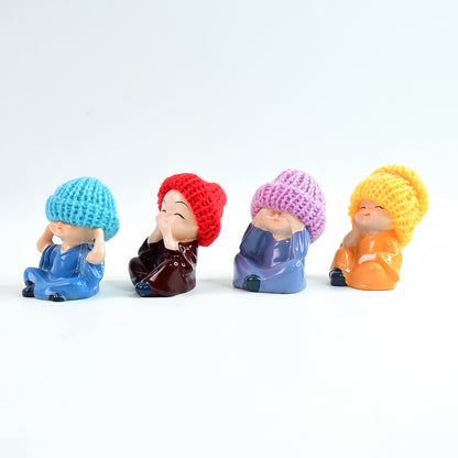 Set of four decorative resin Monk Buddha showpieces by Wukusy, featuring traditional straw hats for home decor.