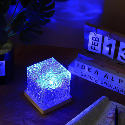 Wukusy dynamic rotating water ripple night lamp with remote control, creating soothing light effects for home decor.