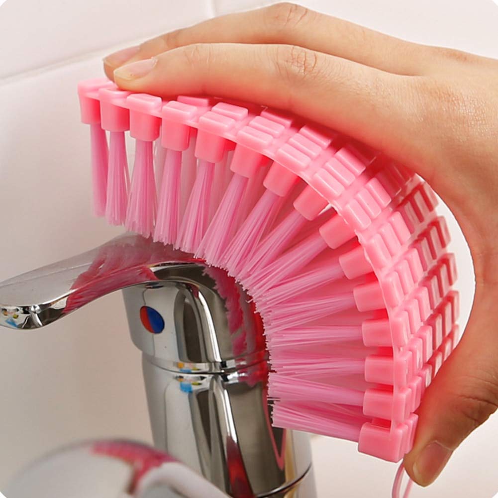 Flexible plastic cleaning brush by Wukusy for kitchen and bathroom cleaning, featuring durable bristles and ergonomic handle.