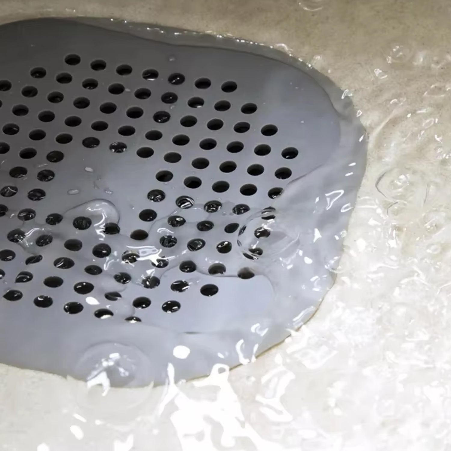 Flexible silicone drain cover strainer by Wukusy, designed to catch debris and prevent clogs in kitchen or bathroom drains.