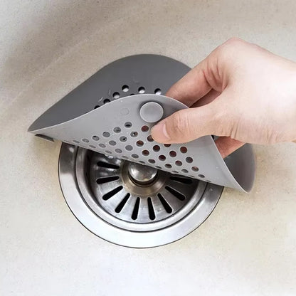 Flexible silicone drain cover strainer by Wukusy, designed to prevent clogs in kitchen or bathroom drains.