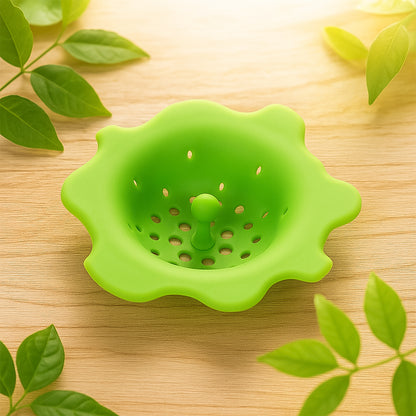 Wukusy flexible silicone sink strainer and drain hair catcher in a kitchen sink, preventing clogs with easy-to-clean design.