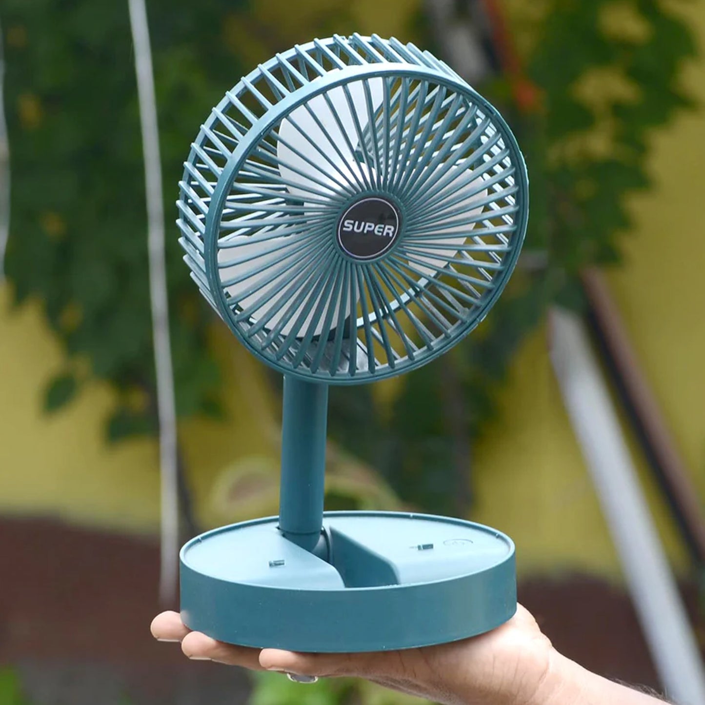 Wukusy foldable mini desk fan with adjustable height and angle, compact home improvement fan for personal cooling.