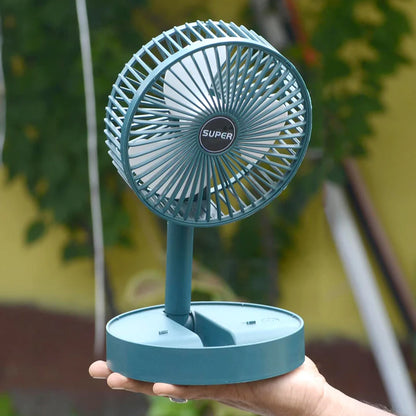 Wukusy foldable mini desk fan with adjustable height and angle, compact home improvement fan for personal cooling.
