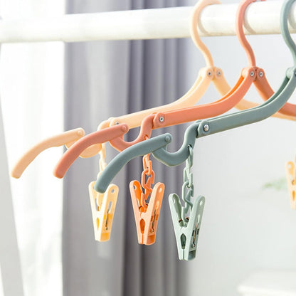 Wukusy folding hanger with clips for clothes, adjustable home improvement hanger, ideal for drying or organizing garments.