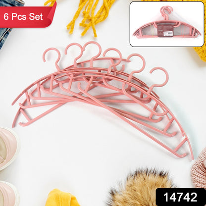 Set of 6 durable plastic cloth hangers from Wukusy, perfect for organizing clothing in home improvement projects.
