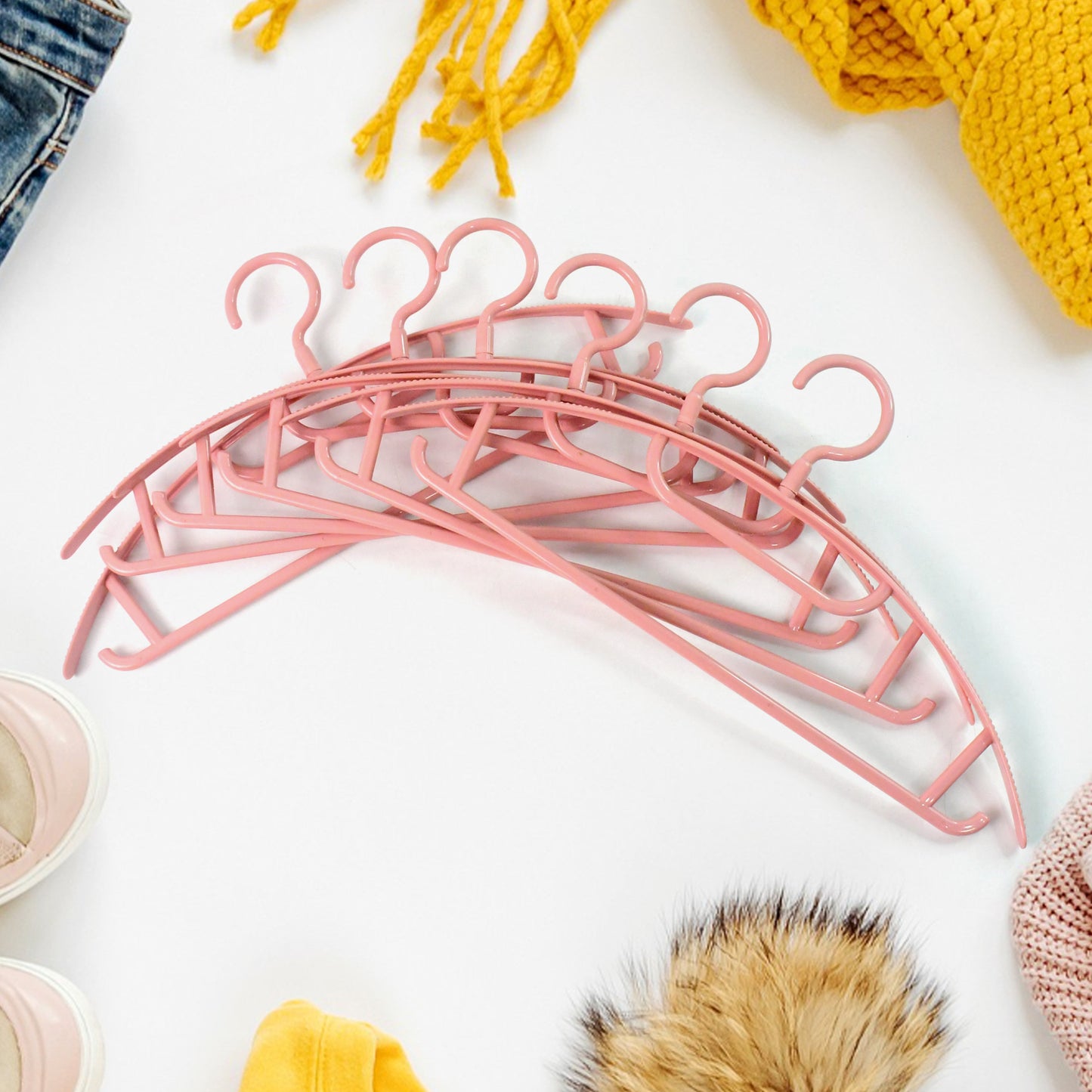 Set of 6 durable plastic Ganesh-shaped cloth hangers by Wukusy for home improvement, ideal for organizing clothes.