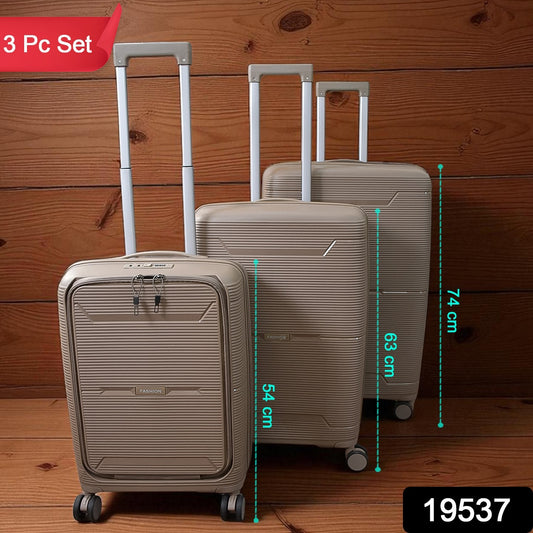 Set of three Wukusy hard-shell trolley luggage bags in mixed colors, durable travel luggage with wheels and handles for easy transport.