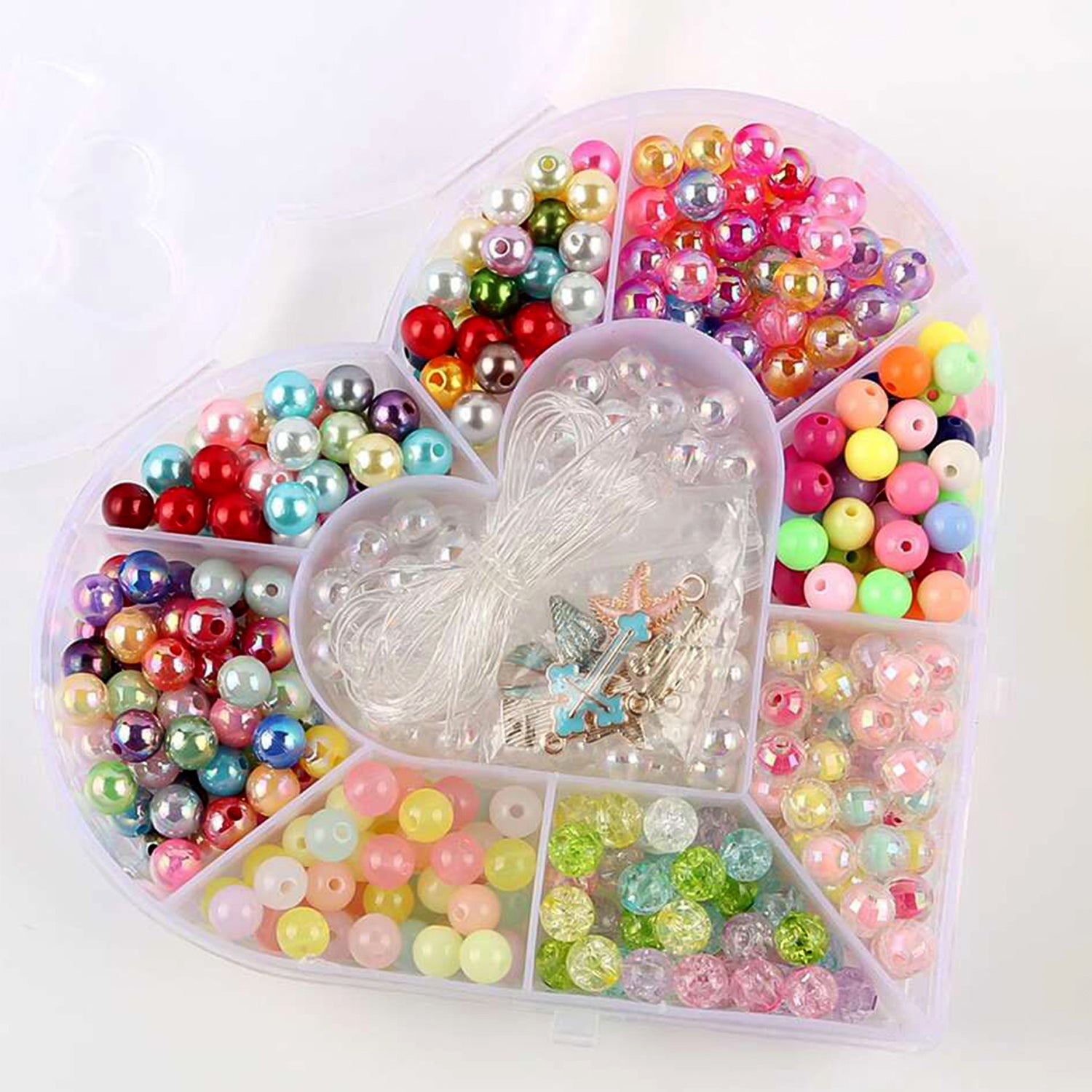 Heart-shaped plastic bead storage organizer box by Wukusy, ideal for organizing craft beads and small items at home.