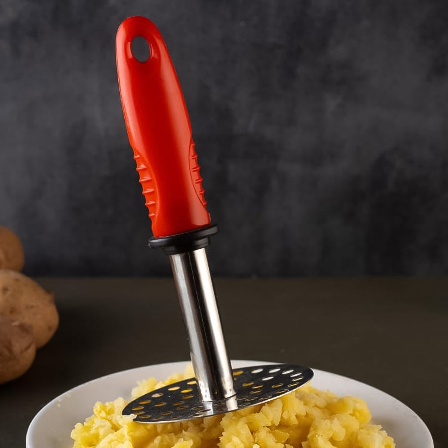 Wukusy high-grade stainless steel potato masher with plastic handle, perfect for pav bhaji and home cooking tasks.
