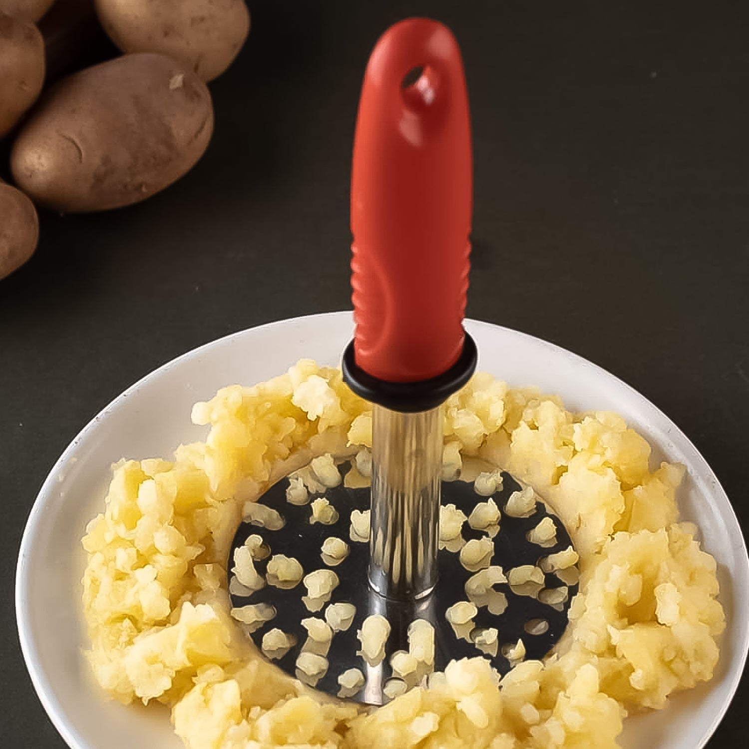Wukusy stainless steel potato masher with plastic handle, ideal for pav bhaji and home cooking, durable and easy to use.