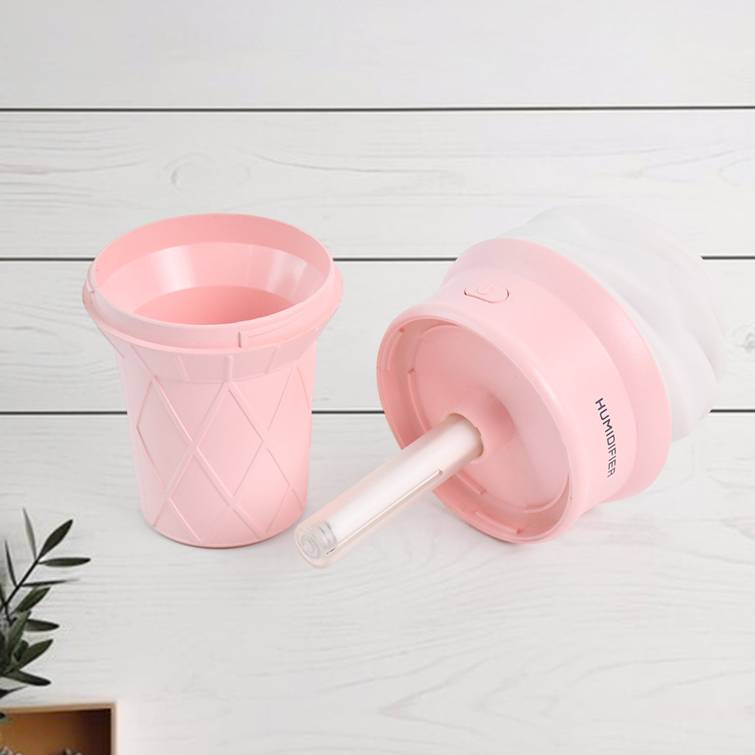 Pink ice cream cone-shaped air freshener humidifier by Wukusy, designed for home improvement, with a cute, realistic cone shape.