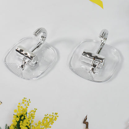 Two large plastic self-adhesive wall hooks from Wukusy for home improvement, ideal for hanging lightweight items.
