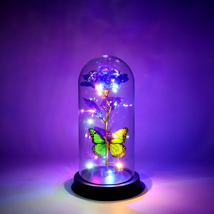 LED preserved rose with colorful butterfly inside a clear plastic dome, decorative home improvement piece by Wukusy, mixed colors.