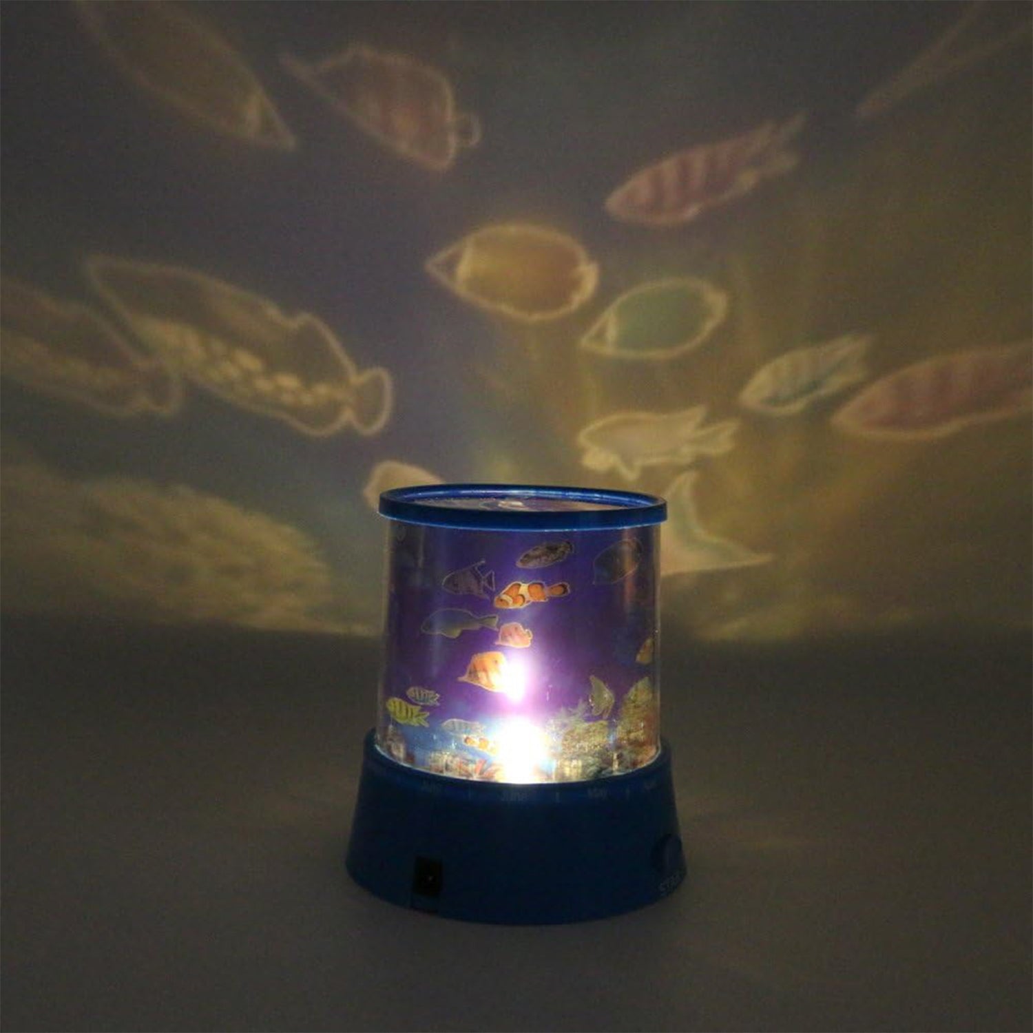 Wukusy LED projector night light for kids' bedroom, battery-operated with rotating motion and music function, home decor and gift.