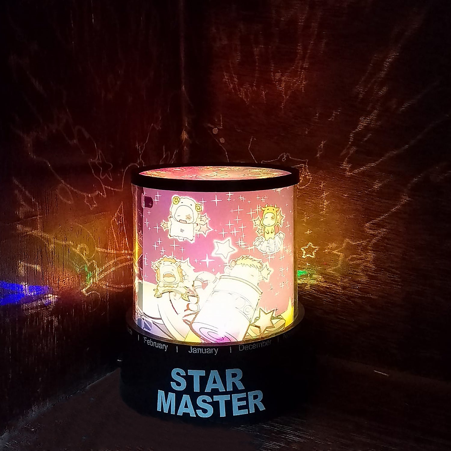 Wukusy LED projector night light lamp with rotating feature, music function, battery operated for kids' bedroom and home decor.