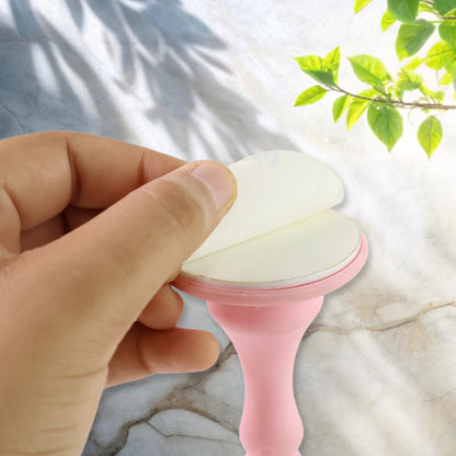 Light pink Wukusy washing machine door holder and stopper, designed to keep washing machine doors open for easy access.