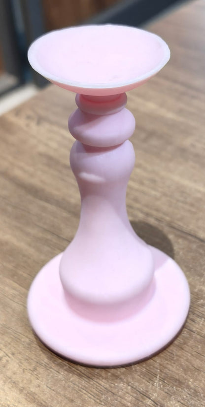 Light pink washing machine door stopper by Wukusy, designed to hold open washing machine doors securely.