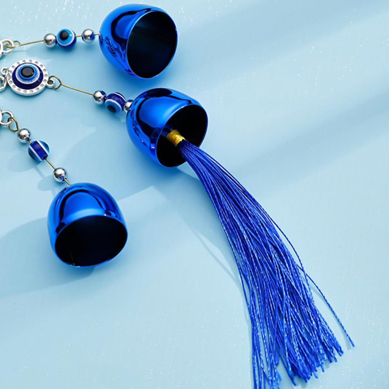 Wukusy metal evil eye wind chime bells with mixed design, hanging outdoors, decorative home improvement accessory.