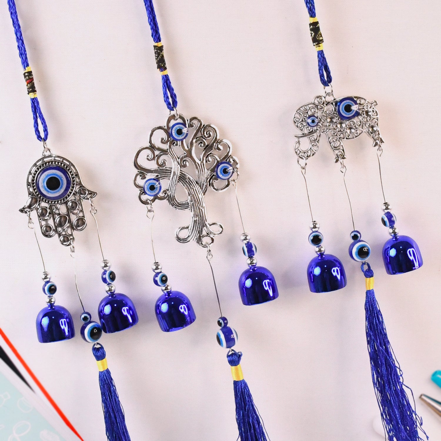 Metal Evil Eye Wind Chime Bells by Wukusy, decorative home improvement piece with mixed design, hanging chime with evil eye motif.