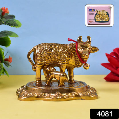 Golden metal Kamdhenu cow with calf figurine by Wukusy, decorative home improvement sculpture, detailed craftsmanship.